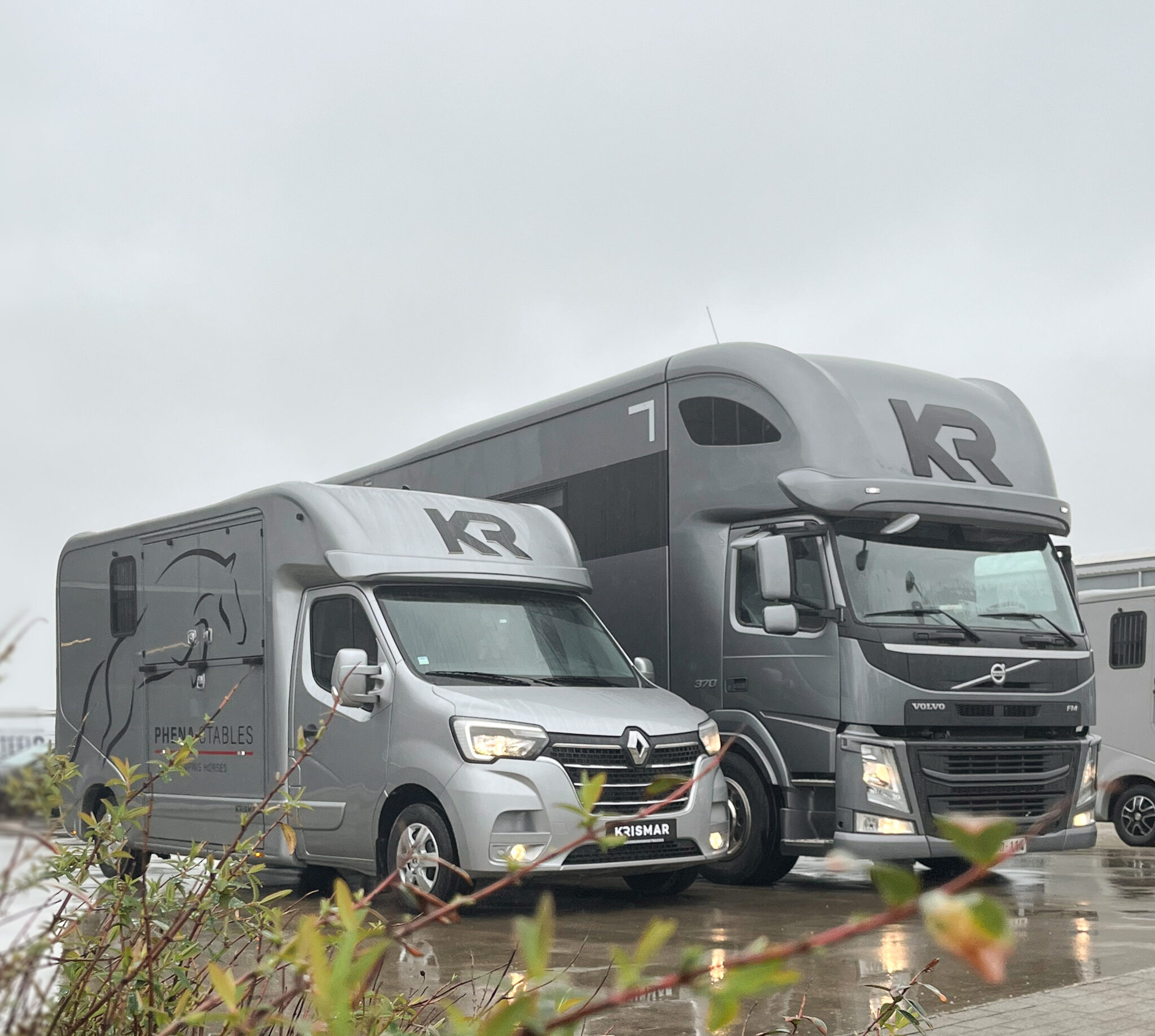 A gray Krismar horse truck with matching Krismar 2-horse.